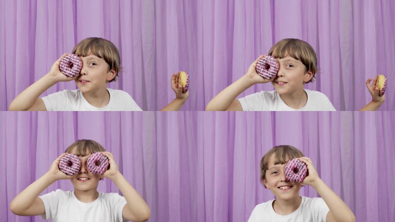 9岁的男孩使用甜甜圈作为眼镜。