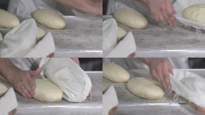 面包师做面包面团。慢动作