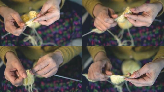 女人手在家编织的特写镜头。
