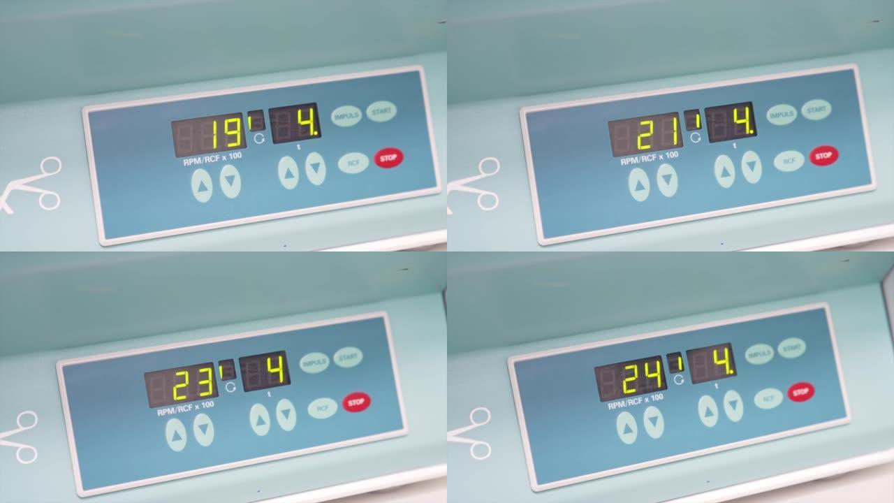 在医院实验室工作的机器的指示器面板。特写。记分牌上的数字变化很快。