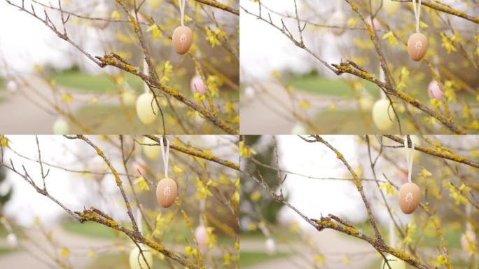 Painted eggs hanging on the tree. Easter game