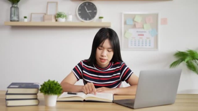 亚洲女学生在线阅读教科书的肖像