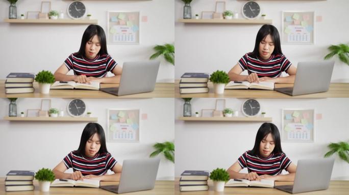 亚洲女学生在线阅读教科书的肖像