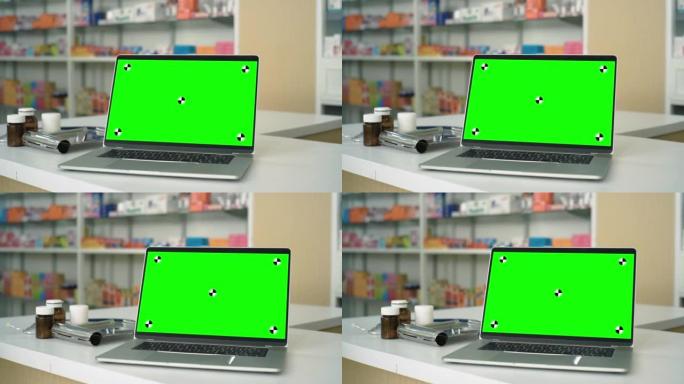 在药房柜台上显示色度键的笔记本电脑的视频片段