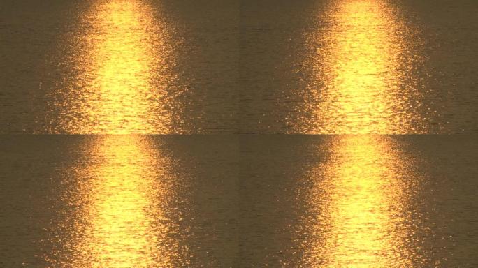 The sun reflects the water in gold