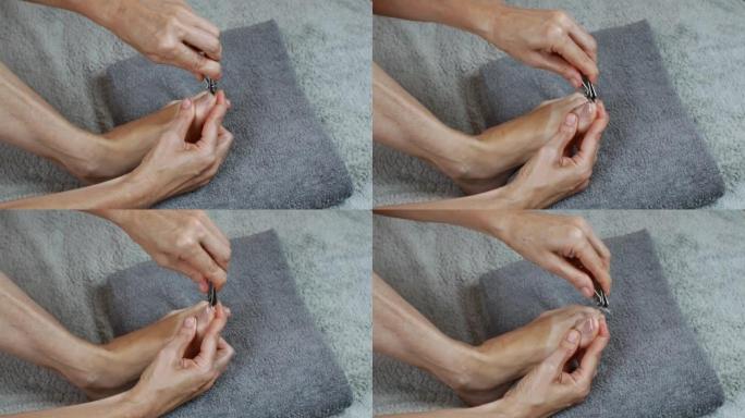 一个女人通过剪脚趾的指甲来照顾她的脚。