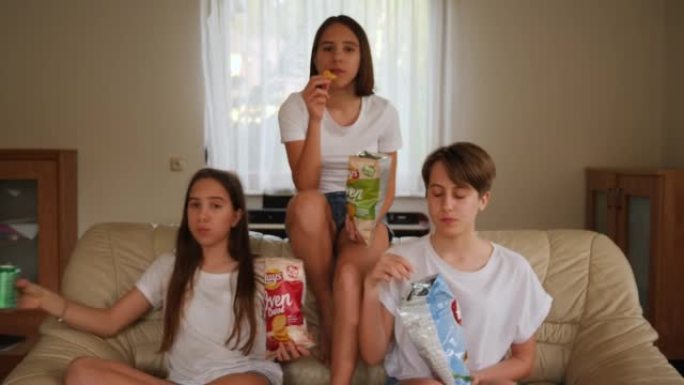 Teenager sisters girls triplet funny sit and eat c