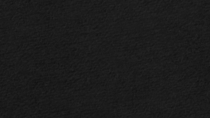 Stucco black paper texture slow moving right loop.