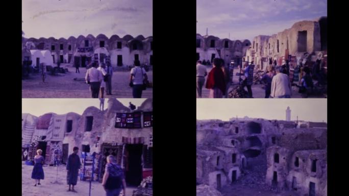 突尼斯1983，El Jem市，人们和游客走在小巷