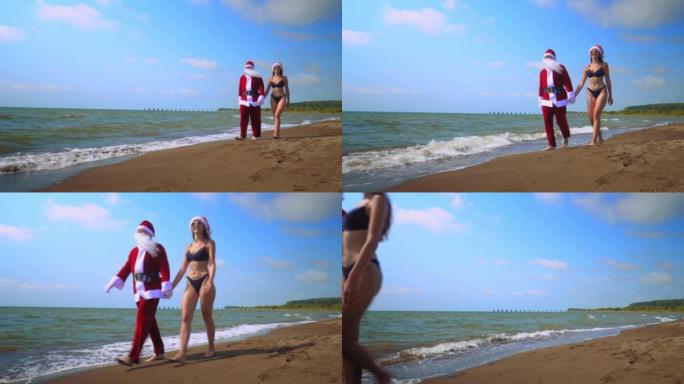 圣诞老人与性感的女人或女孩一起沿着海岸瘟疫行走