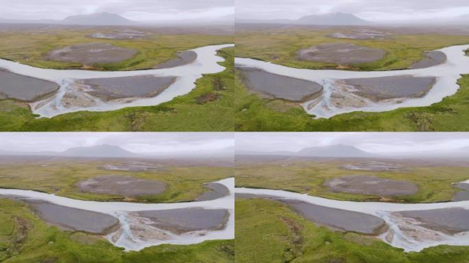 冰岛高地蜿蜒的桑达河与沙洲的鸟瞰图。