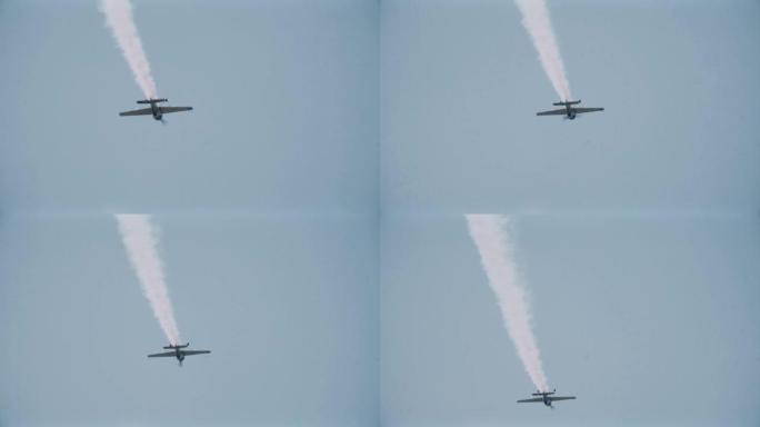 带有烟雾踪迹的领航飞机在空中特技表演