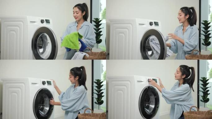 快乐美丽的家庭主妇打开洗衣机的前部，即将在周末将脏衣服放入洗衣机中。女人洗衣服。