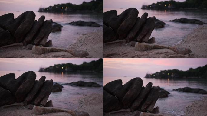 海上日落和岩石海滩