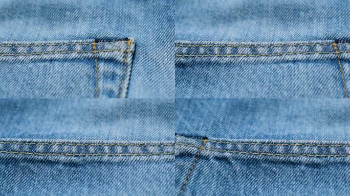 浅蓝色牛仔裤上的特写接缝。蓝色牛仔布纹理背景
