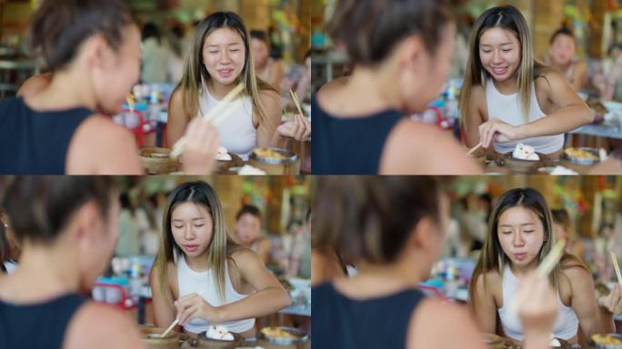 亚洲女人用筷子吃中餐饺子的4k俯视图组