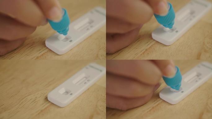 自动测试条上的液体特写手滴，特写