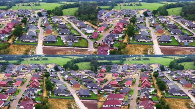 鸟瞰图:德国的新发展区，沿着一条新道路和小花园有单户住宅