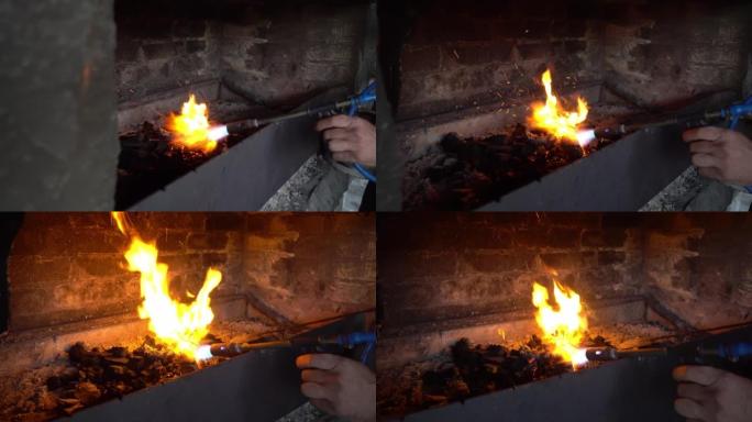用煤气炉点燃煤在烤架上烤肉。