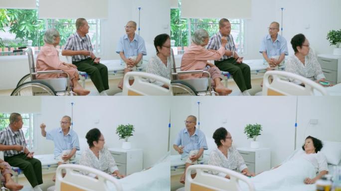 资深亚洲老年女性戴着眼镜，坐在椅子上，喜欢和躺在病人床上在疗养院休息的朋友聊天，而其他资深朋友则在一