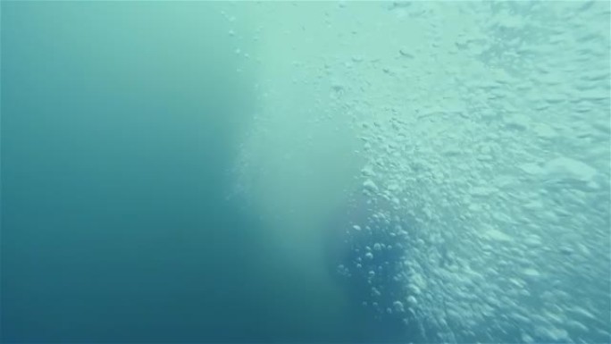 Middle-aged scared man underwater in lake. Male ho