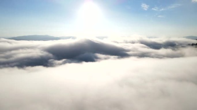 above the clouds mountains blue sky