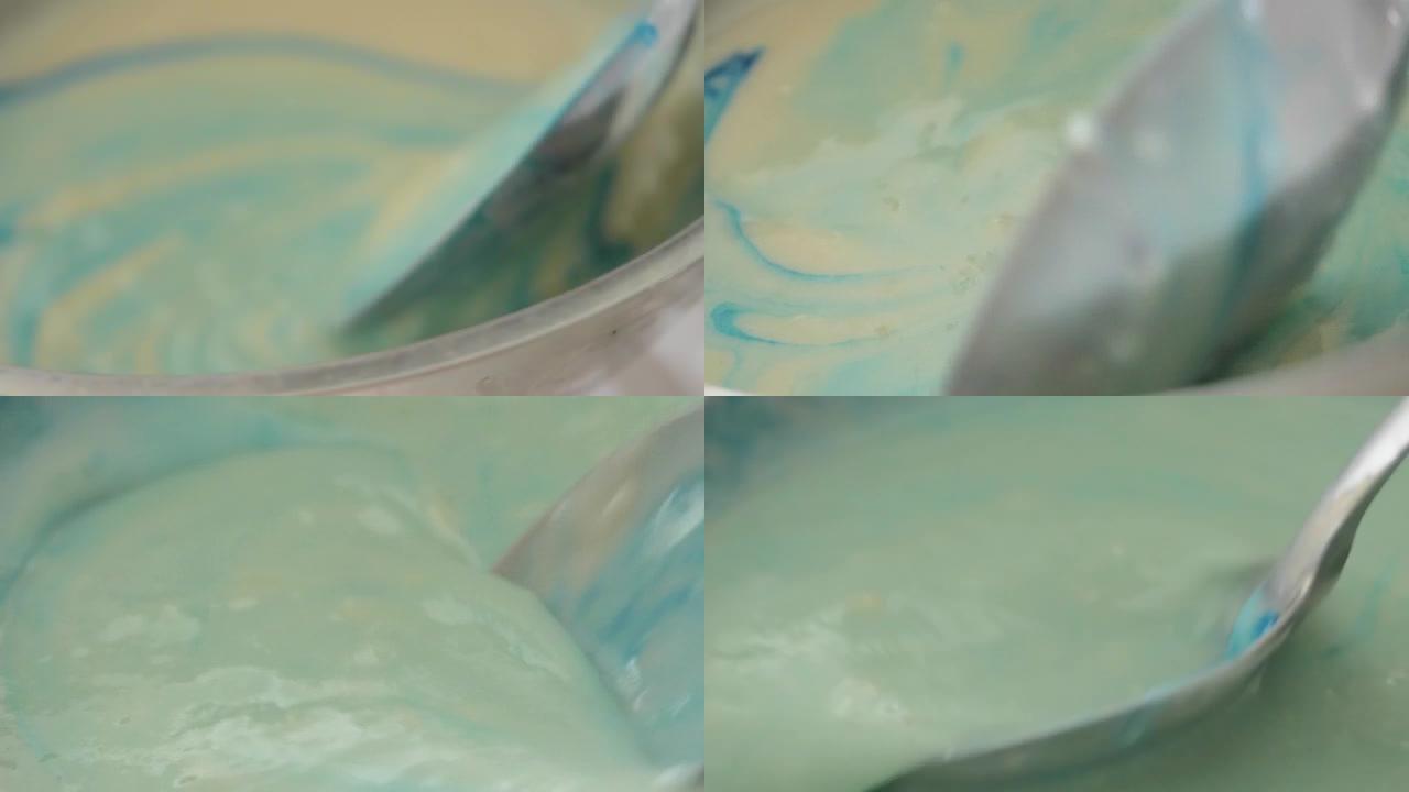 将颜色与奶油混合在一起，在家中自制冰淇淋，生活方式概念。