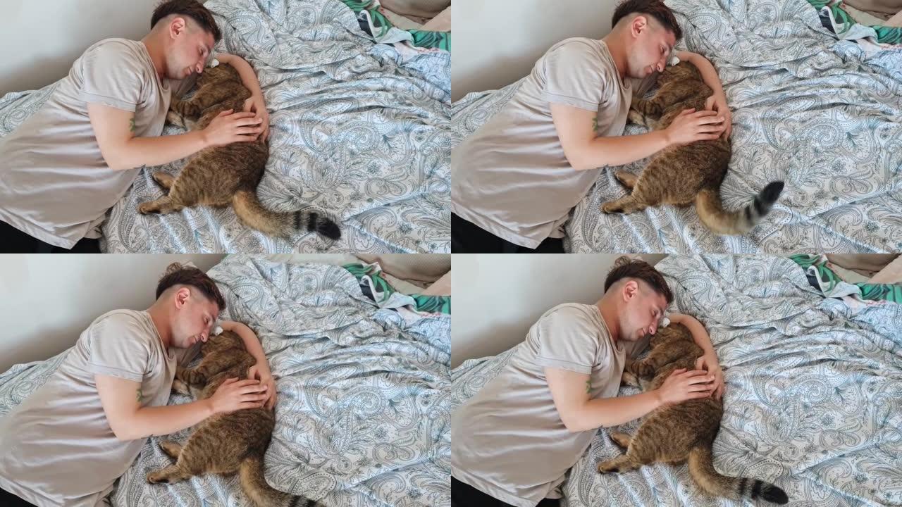 男人和他的猫一起睡在床上