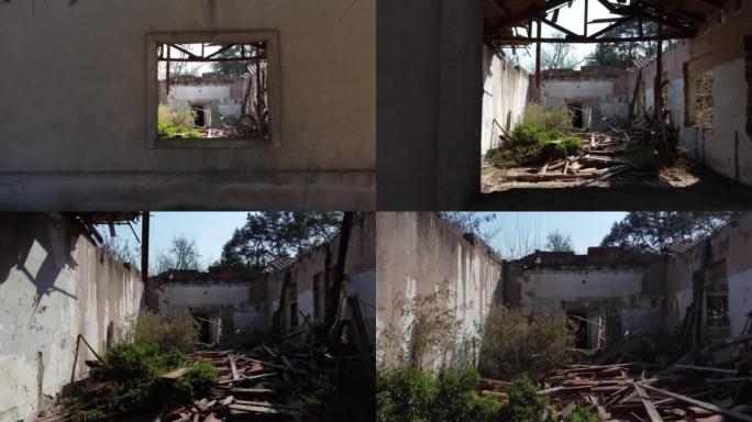 废弃的建筑物，屋顶上掉落的红色黏土砖躺在建筑物内，植物在建筑物内生长空中视频。