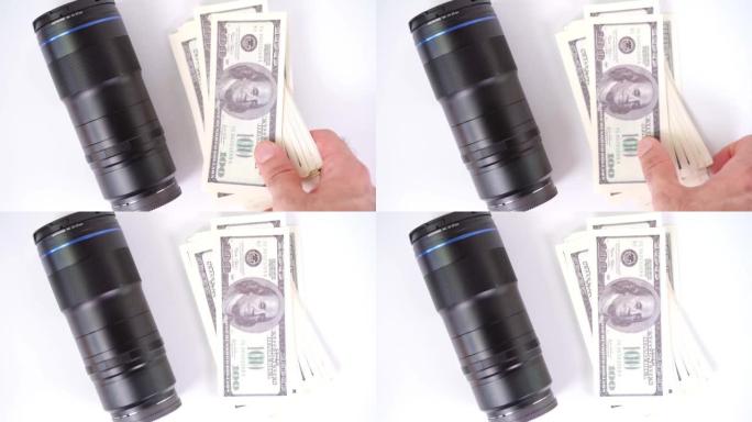 Lens and money on a white background