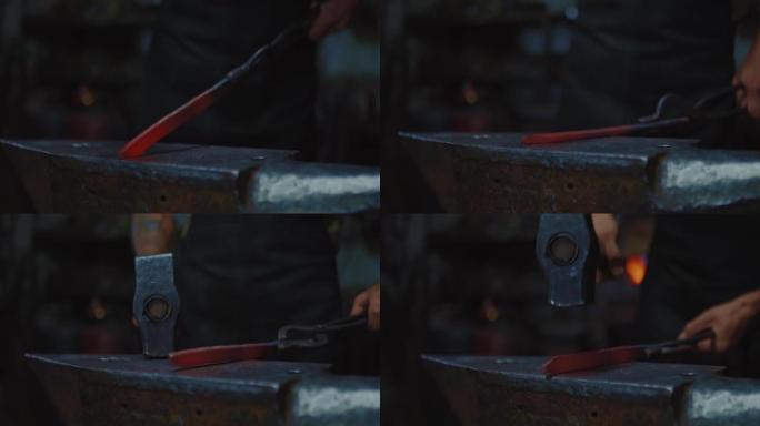 专业铁匠用铁锤和铁砧在锻造中塑造未来的刀，特写视图，4K，Prores
