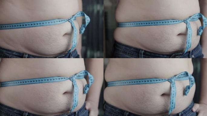 肥胖的腹部用卷尺打结。减肥和饮食，超重和肥胖。慢动作