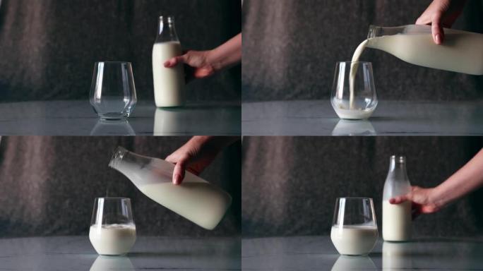 一整瓶的白牛奶被倒入桌子上的玻璃杯中。