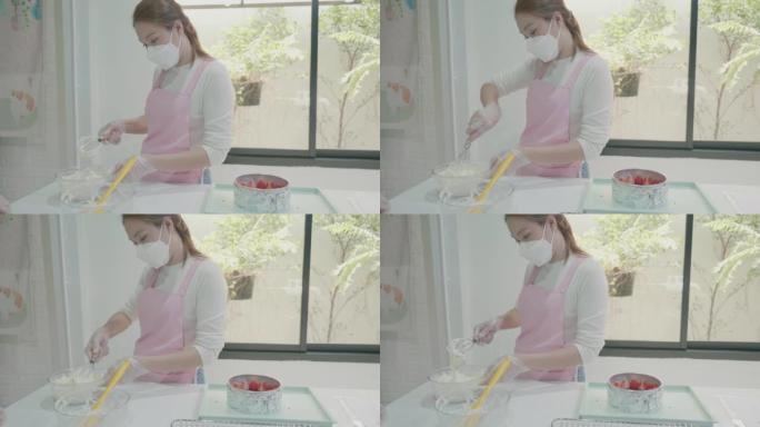 女人使用电动手动搅拌器在碗中混合蛋糕成分