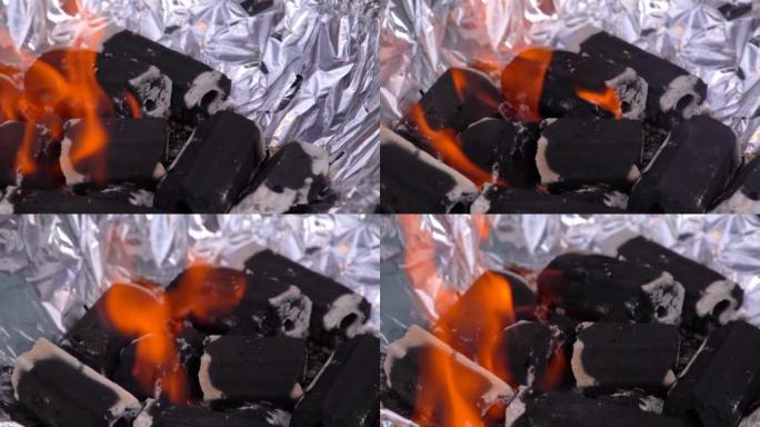 烧木头的炉子里的热煤，燃烧煤的全框镜头