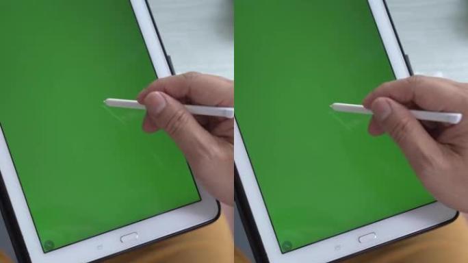 用无线数字手写笔在绿屏色度键智能平板显示器上书写。