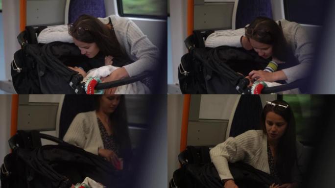 妈妈和宝宝。带着小男孩去火车站的幸福家庭。年轻的母亲带着一个小孩乘坐地铁旅行。带着孩子旅行。做母亲，