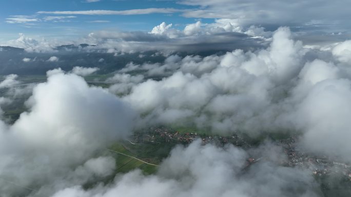 航拍白云之下的瑞丽市村庄与沃野