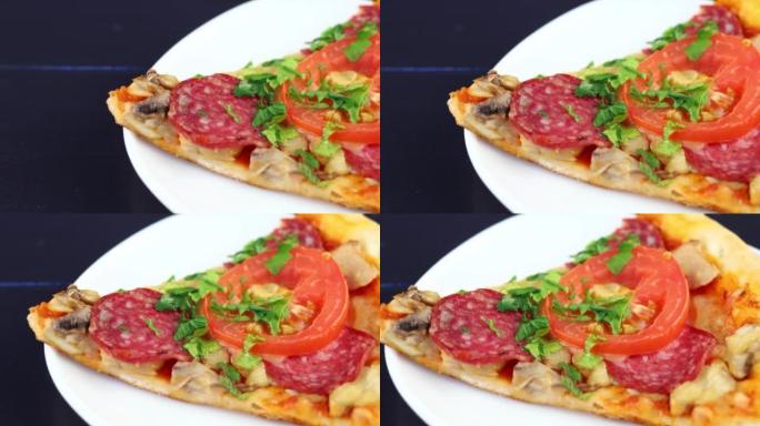 Sliced pizza in a plate. Closeup view of a slice o
