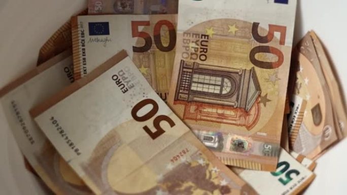 洗钱概念。洗衣机里的欧元钞票，非法现金50欧元，欧洲逃税通货膨胀和减值。影子经济，假钞
