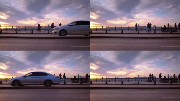 伊斯坦布尔美丽的日落在路过的人和驾驶汽车的背景下