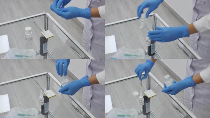 牙医的手正在准备一种混合物，用于填充牙齿。在手术刀的尖端，医生拿出一个石膏填充在一个平面上，以适当的