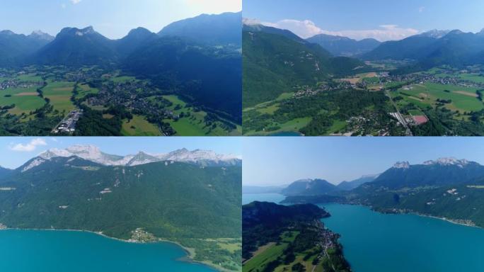 空中拍摄山湖，周围有田野和村庄