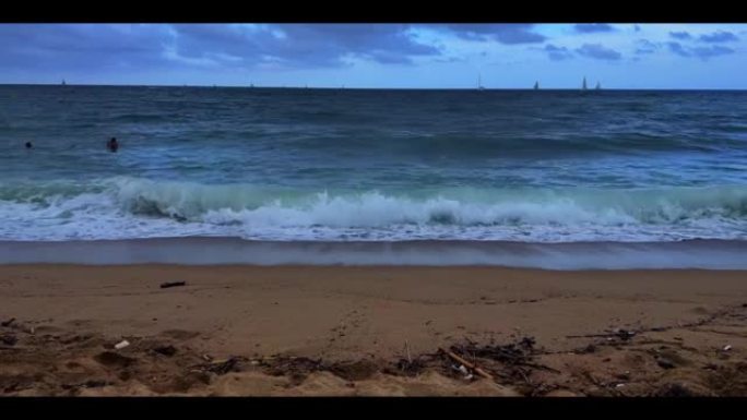 Aerial view of sea waves breaking sandy beach