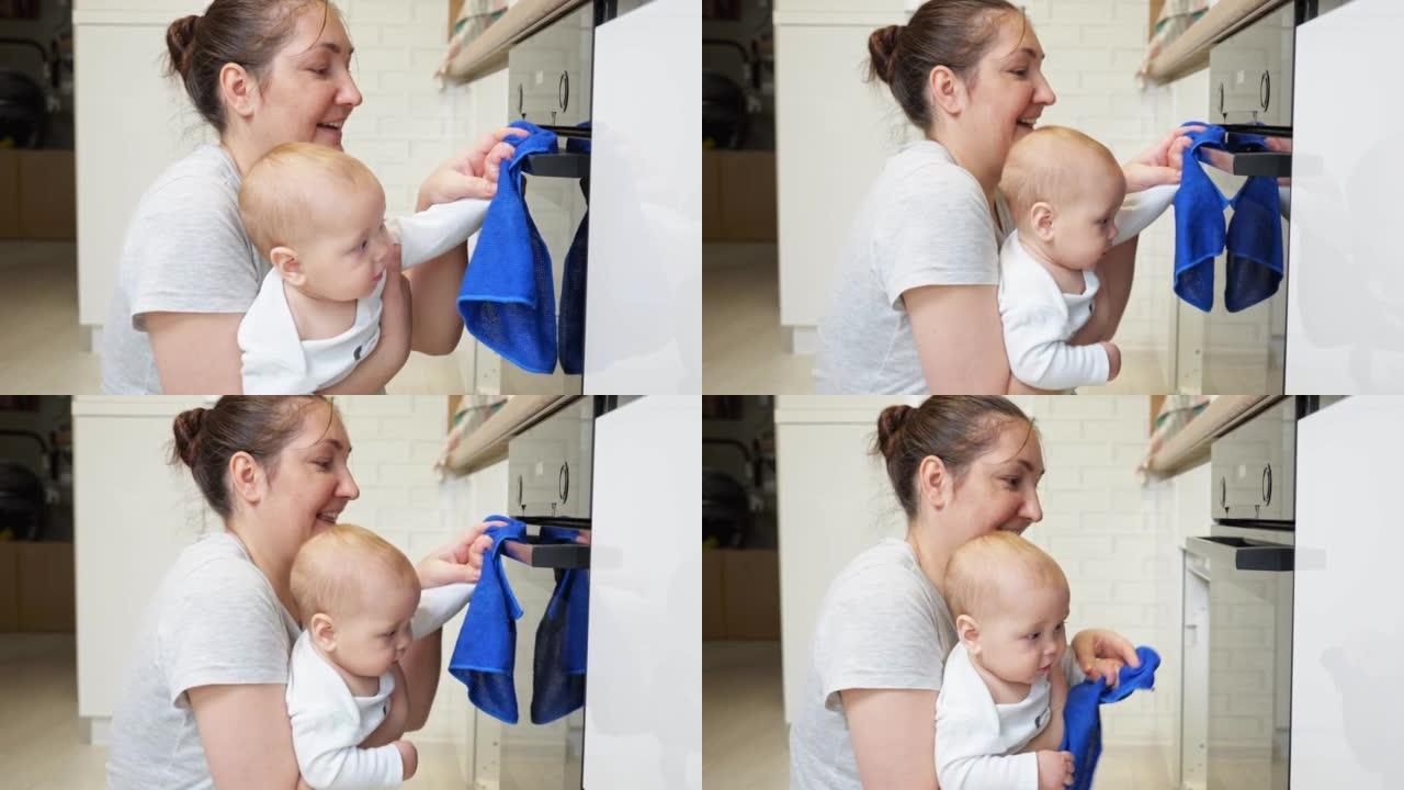 婴儿帮助母亲整理和清洁厨房中的公用设施