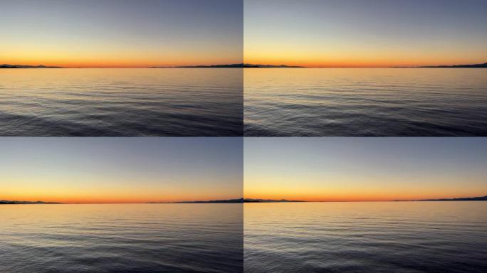 美丽的明亮橙色日落在海洋地平线的背景下丰富的红橙色沉默平静和放松的夜晚在太平洋温哥华岛旅游目的地