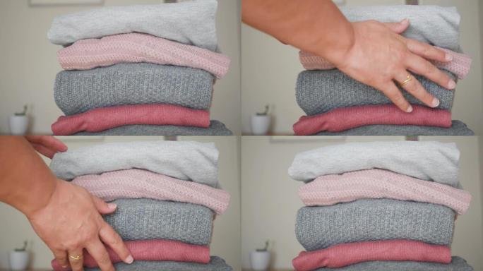 一堆灰色和粉红色羊毛衫的视频