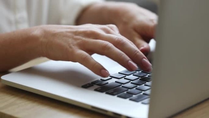 自由职业者在家工作在笔记本电脑上，女性手拉手，商业概念