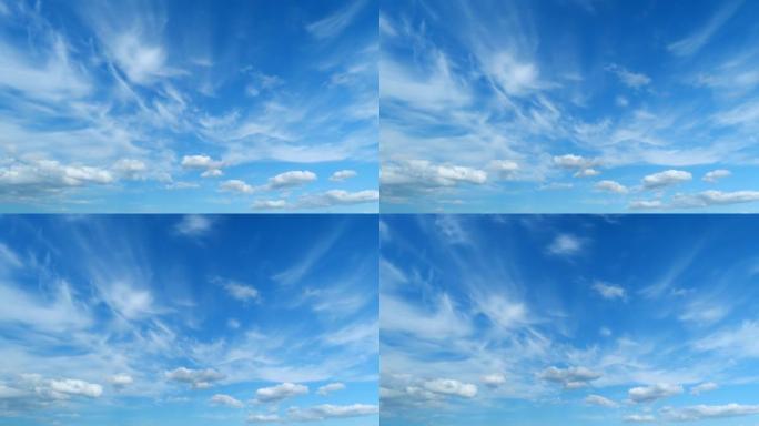 蓬松的分层云天空大气。雄伟惊人的蓝天，云彩。白色和蓝色。延时。