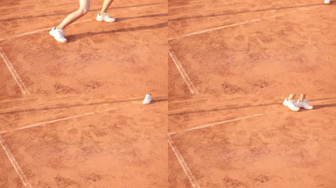专业装备的女网球运动员用球拍用力敲打网球。